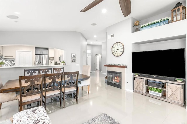 interior space featuring ceiling fan and lofted ceiling