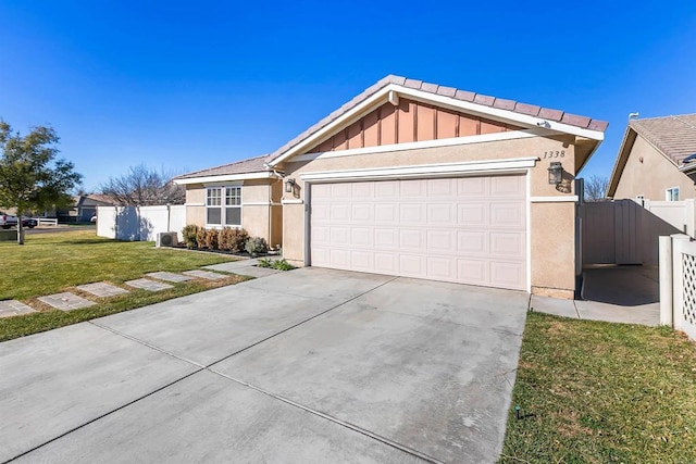 single story home with a front yard and a garage