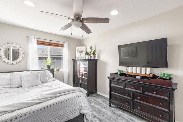 bedroom featuring light hardwood / wood-style floors and ceiling fan