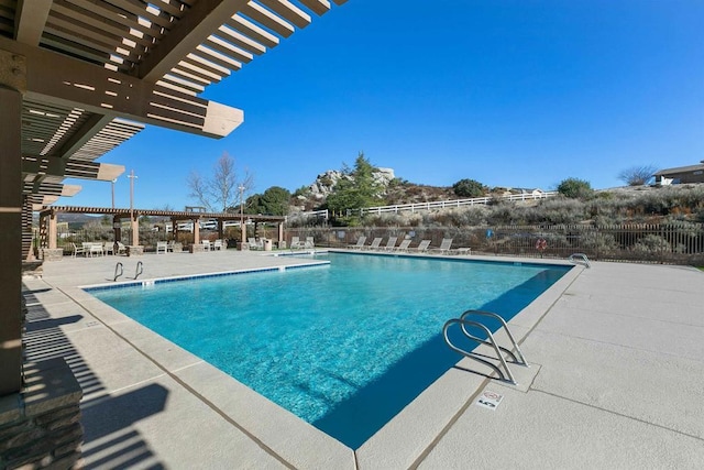 view of swimming pool featuring a pergola