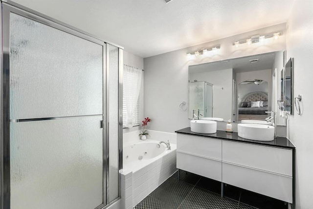 bathroom featuring tile patterned flooring, vanity, and independent shower and bath