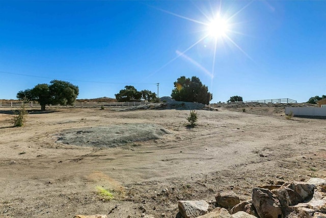 view of yard with a rural view