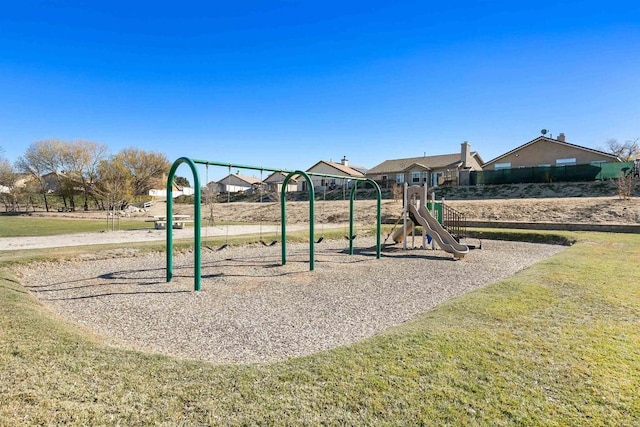 view of playground with a lawn