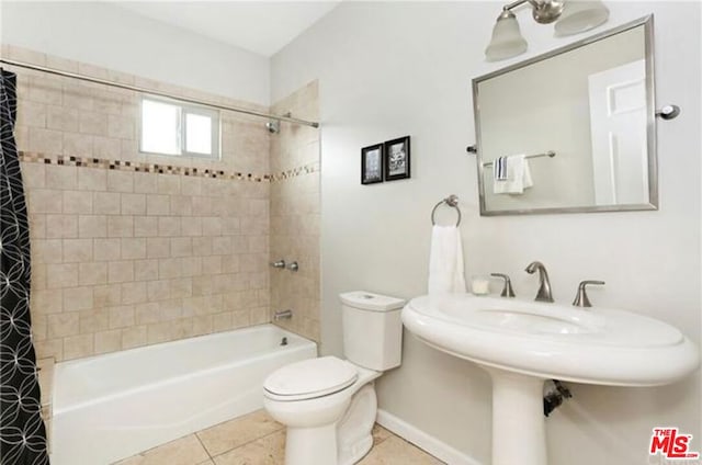 bathroom featuring tile patterned flooring, toilet, and shower / bathtub combination with curtain