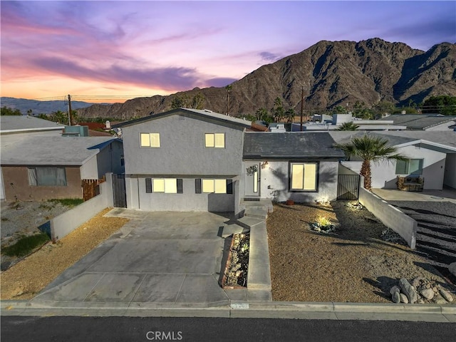 view of front of property with a mountain view