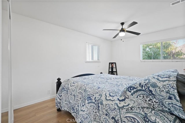 bedroom with light wood-type flooring and ceiling fan