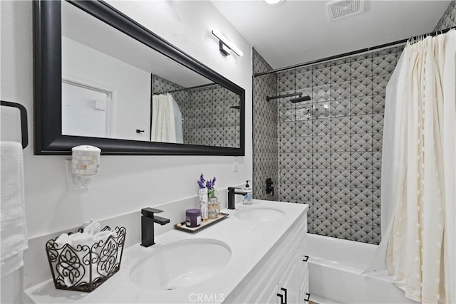 bathroom with vanity and shower / tub combo