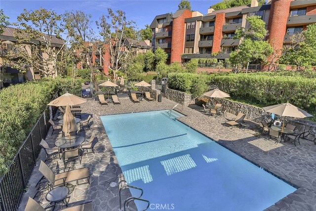 view of pool featuring a patio