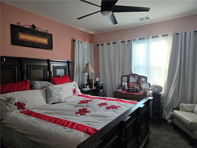 bedroom featuring ceiling fan and dark colored carpet