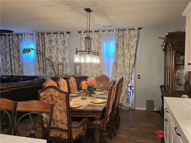 dining space featuring dark hardwood / wood-style floors