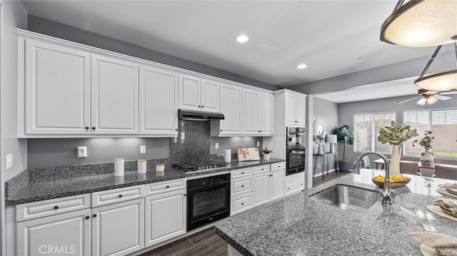 kitchen with decorative backsplash, sink, white cabinets, and black gas cooktop