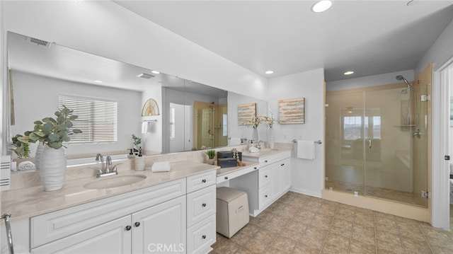 bathroom with an enclosed shower and vanity