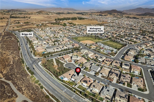 drone / aerial view featuring a mountain view