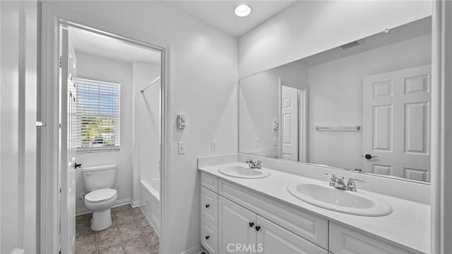 full bathroom featuring toilet, vanity, and shower / bathing tub combination