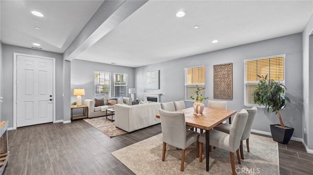 dining area with dark hardwood / wood-style floors