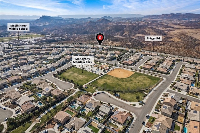 birds eye view of property featuring a mountain view