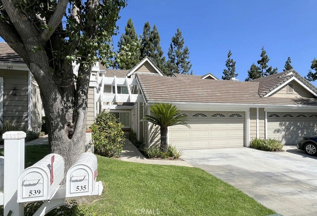 view of front facade with a garage and a front lawn