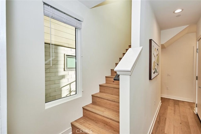 stairway with wood-type flooring