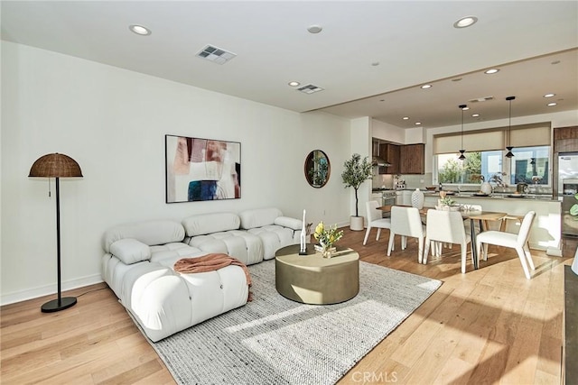 living room with light hardwood / wood-style flooring