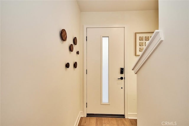 doorway with light wood-type flooring