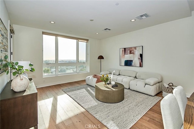 living room with light hardwood / wood-style floors