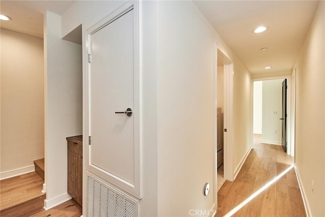 corridor with light wood-type flooring