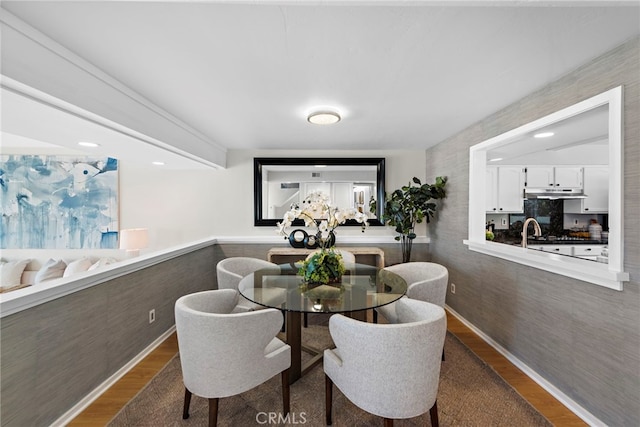 dining space with dark wood-type flooring