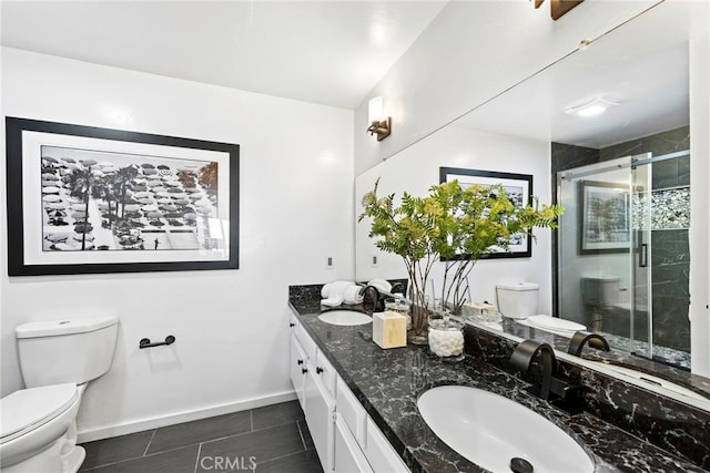 bathroom with toilet, tile patterned flooring, an enclosed shower, and vanity