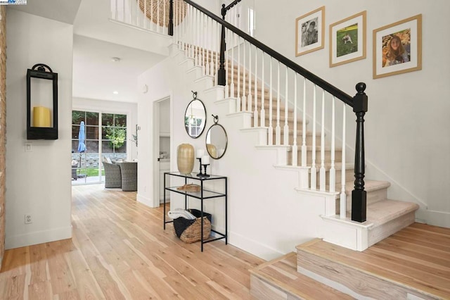 stairway featuring hardwood / wood-style flooring