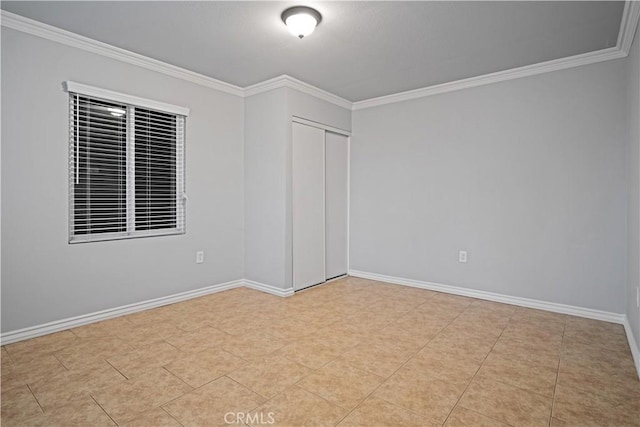 tiled spare room with ornamental molding