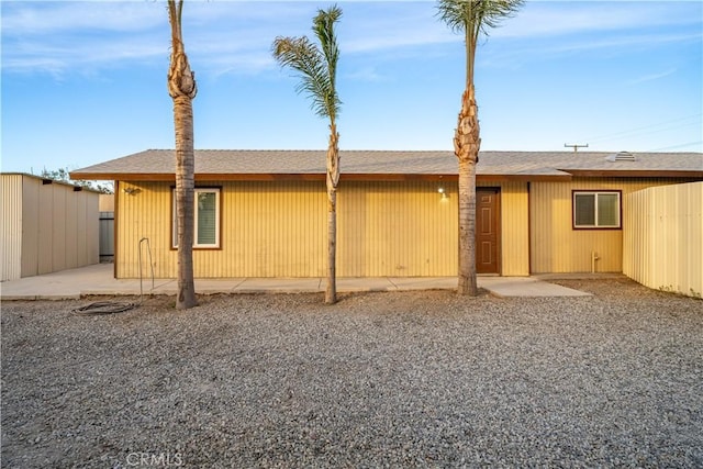 rear view of property featuring a patio area