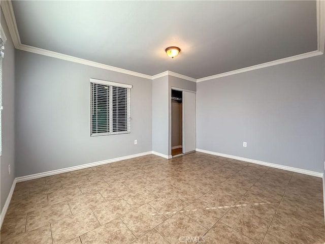 unfurnished bedroom featuring crown molding, tile patterned flooring, and a closet