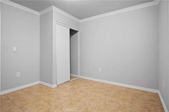 unfurnished bedroom with crown molding and light tile patterned floors