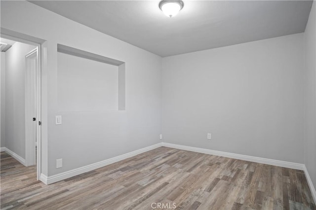 unfurnished room featuring light hardwood / wood-style flooring