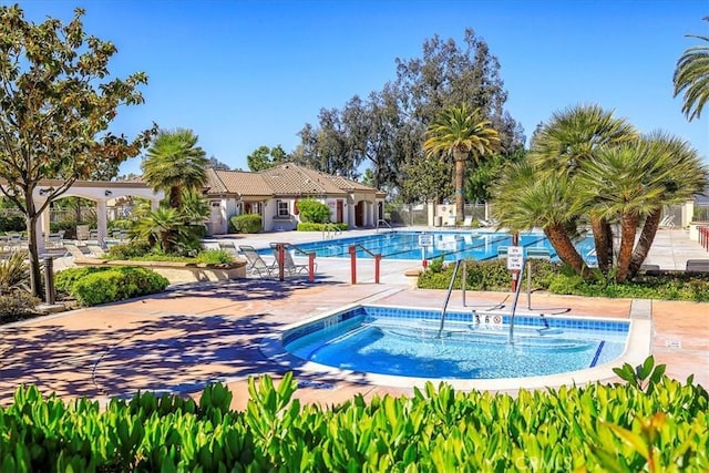 view of pool featuring a patio area