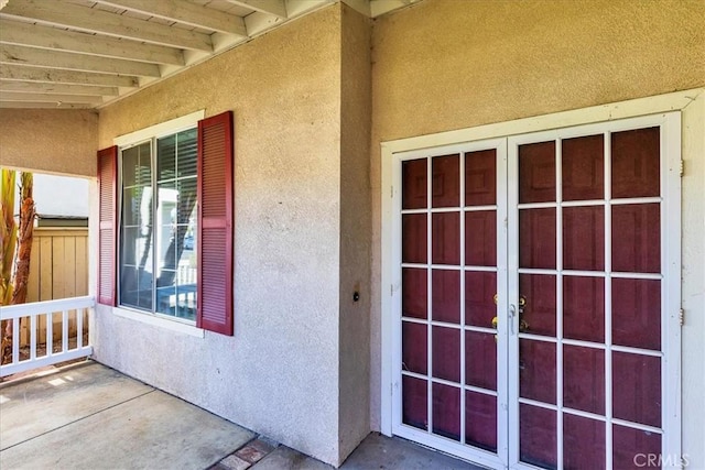 entrance to property featuring french doors