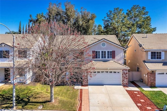 view of front property with a front yard and a garage