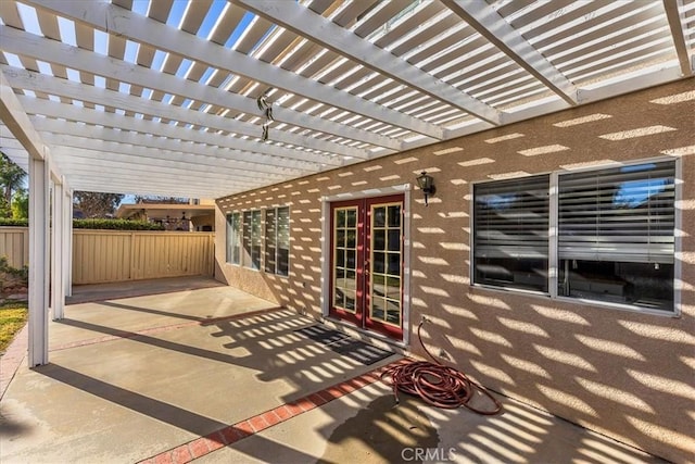 view of patio with french doors and a pergola