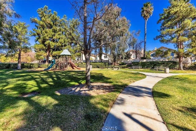 surrounding community featuring a lawn and a playground