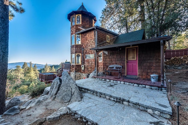 rear view of house featuring a mountain view