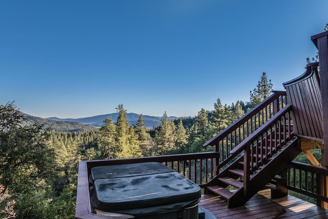 wooden deck with a mountain view