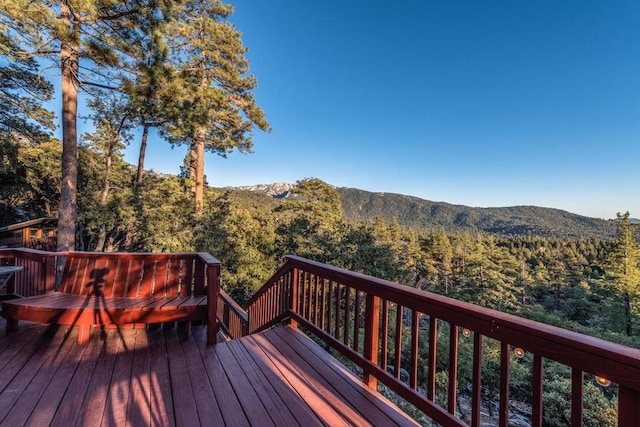 wooden terrace with a mountain view