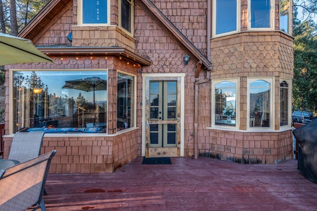 doorway to property with a wooden deck