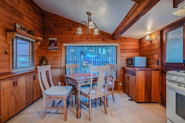 dining area with a notable chandelier, lofted ceiling with beams, and wooden walls