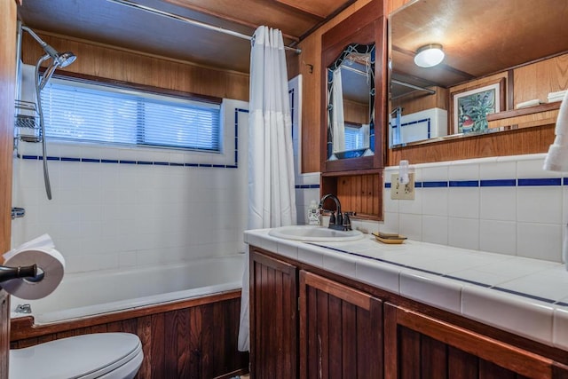 full bathroom with shower / bath combination with curtain, toilet, backsplash, and vanity