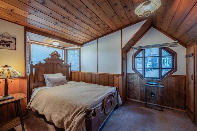 carpeted bedroom with wooden ceiling, multiple windows, lofted ceiling, and wood walls