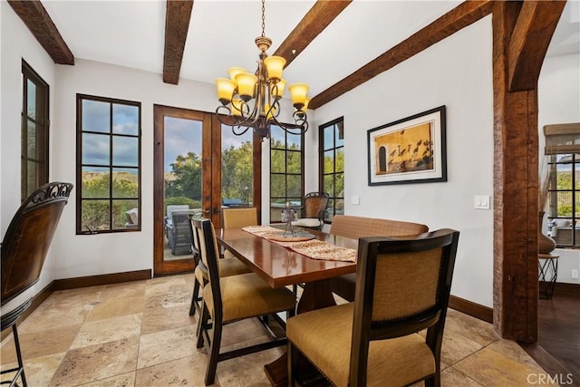 dining area featuring beamed ceiling, a healthy amount of sunlight, and a notable chandelier