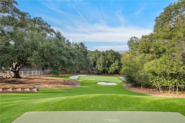 surrounding community featuring a lawn