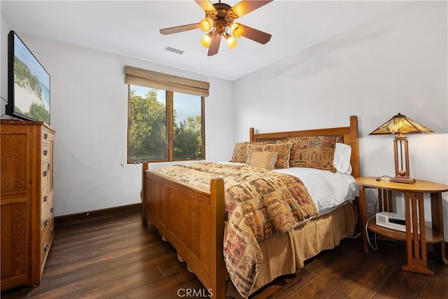 bedroom featuring ceiling fan and dark hardwood / wood-style floors