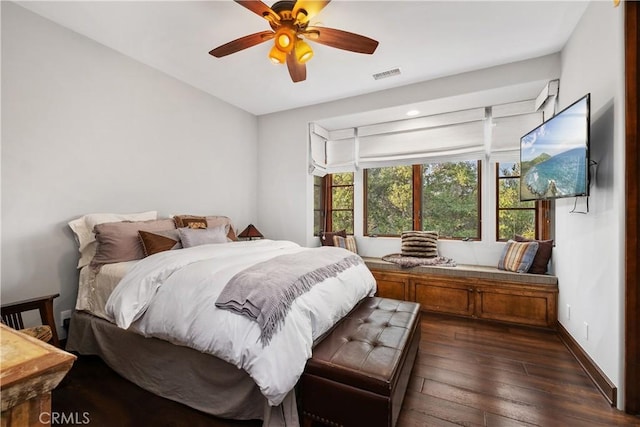 bedroom featuring ceiling fan and dark hardwood / wood-style flooring